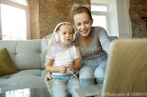 Image of Teacher and little girl, or mom and daughter. Homeschooling concept