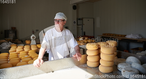 Image of Cheese maker at local production factory