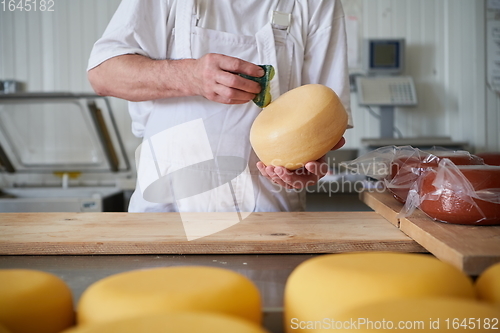 Image of Cheese maker at local production factory