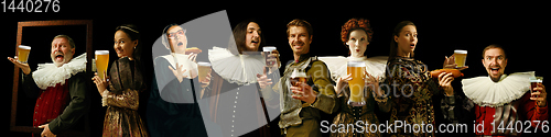 Image of Young people as a medieval grandees on dark background, oktoberfest