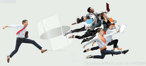 Image of Office worker s or ballet dancers jumping on white background