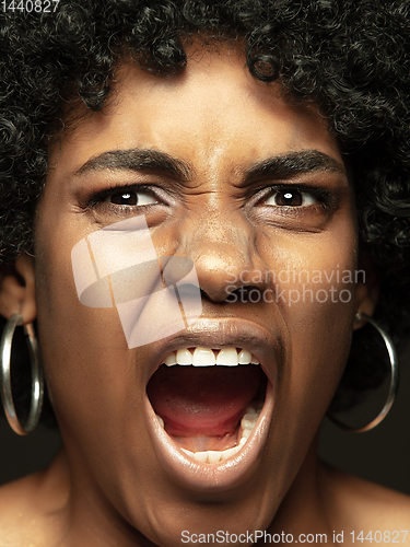 Image of Close up portrait of young african-american emotional girl