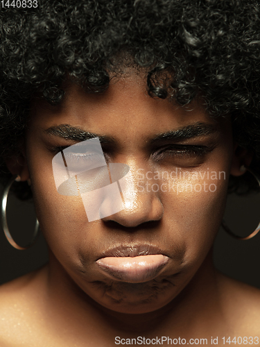 Image of Close up portrait of young african-american emotional girl