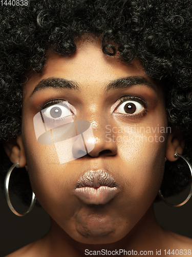 Image of Close up portrait of young african-american emotional girl