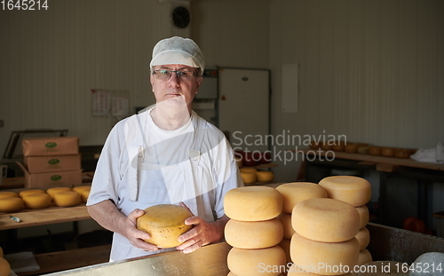 Image of Cheese maker at local production factory