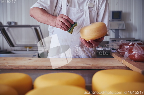 Image of Cheese maker at local production factory