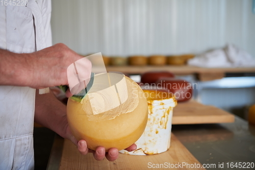 Image of Cheese maker at local production factory