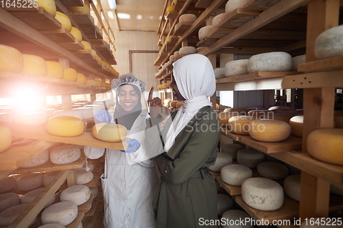 Image of business woman team in local cheese production company
