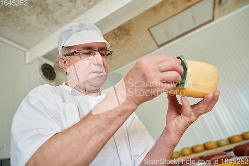 Image of Cheese maker at local production factory