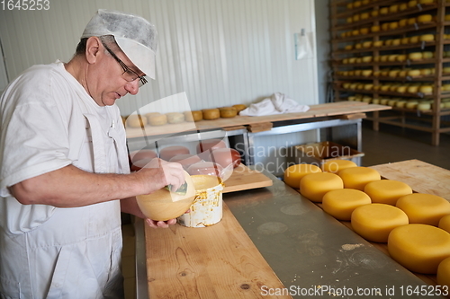 Image of Cheese maker at local production factory