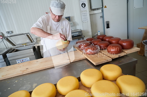 Image of Cheese maker at local production factory