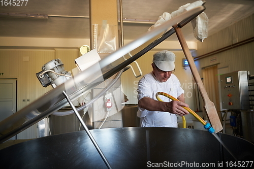 Image of Cheese maker at local production factory