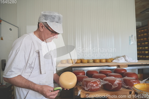 Image of Cheese maker at local production factory