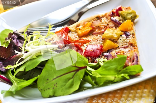 Image of Vegetarian pizza with salad