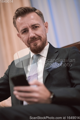 Image of Portrait of smiling ceo at modern office in stylish suit