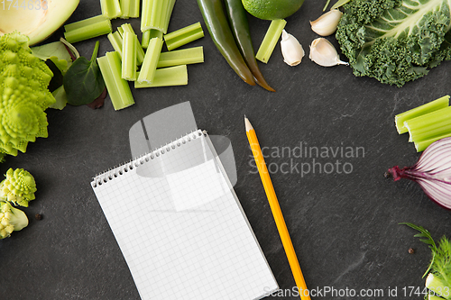 Image of green vegetables and diary with empty pages