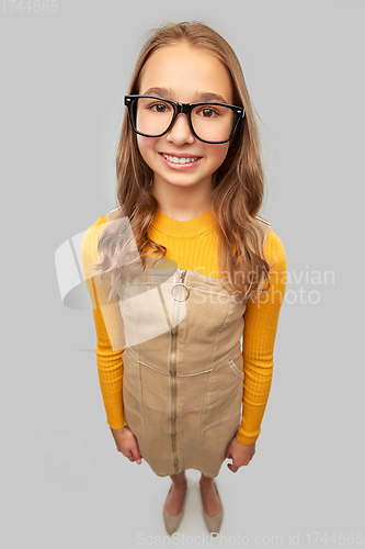 Image of smiling teenage student girl in glasses