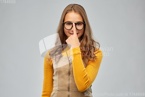 Image of smiling teenage student girl in glasses