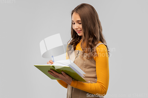 Image of teenage student girl with notebook or diary
