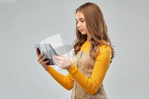 Image of teenage girl using tablet computer