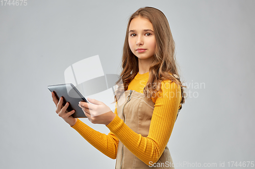 Image of teenage girl using tablet computer