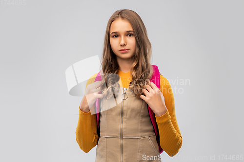 Image of smiling teenage student girl with backpack