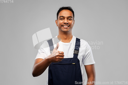 Image of happy indian worker or builder showing thumbs up