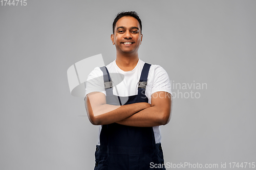 Image of happy indian worker or builder with crossed arms