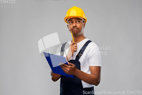 Image of thinking builder with clipboard and pencil