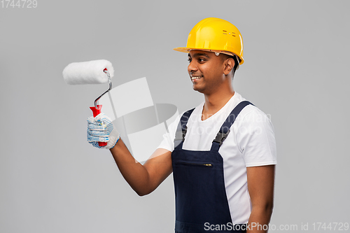 Image of happy indian painter or builder with paint roller