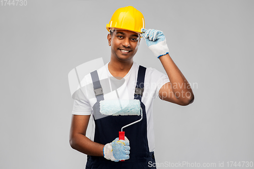 Image of happy indian painter or builder with paint roller