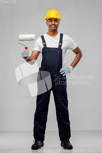 Image of happy indian painter or builder with paint roller