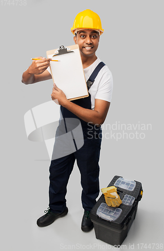 Image of builder in helmet with clipboard and tool box