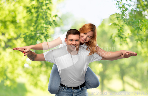 Image of happy couple in white t-shirts having fun