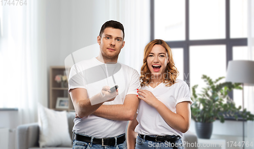 Image of couple with tv remote control