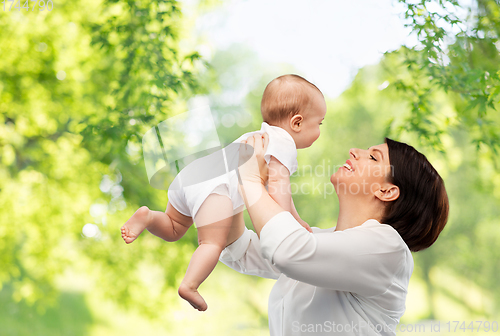 Image of happy middle-aged mother with little baby daughter