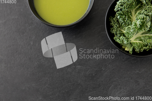 Image of kale cabbage cream soup in bowl with spoon