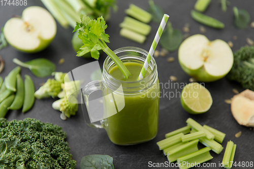Image of close up of glass mug with green vegetable juice