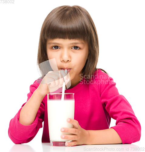 Image of Cute little girl with a glass of milk