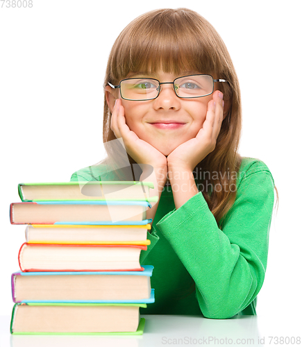 Image of Little girl is reading a book