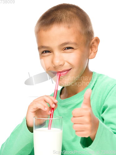 Image of Cute little boy with a glass of milk