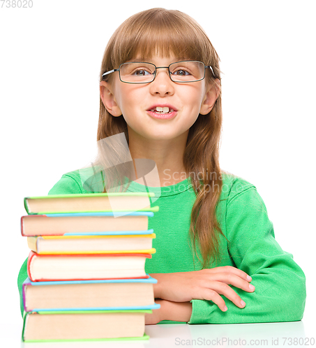 Image of Little girl is reading a book