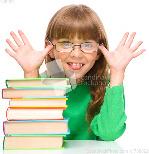 Image of Little girl is reading a book