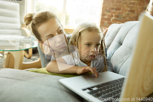 Image of Teacher and little girl, or mom and daughter. Homeschooling concept