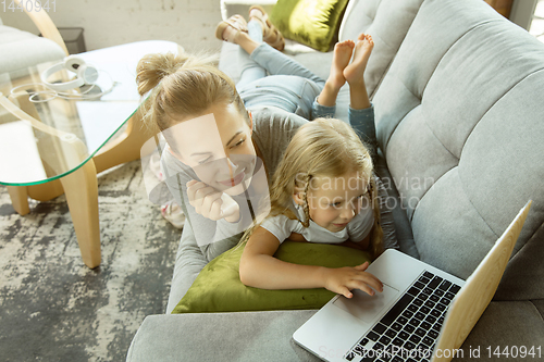 Image of Teacher and little girl, or mom and daughter. Homeschooling concept