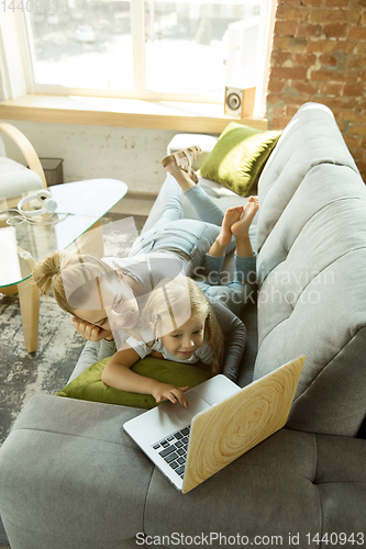 Image of Teacher and little girl, or mom and daughter. Homeschooling concept