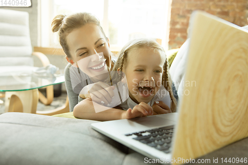 Image of Teacher and little girl, or mom and daughter. Homeschooling concept