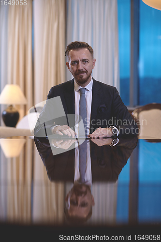 Image of business man using tablet computer