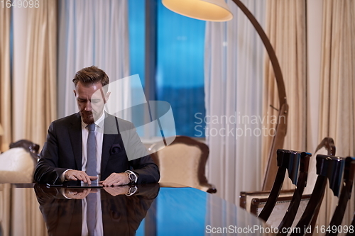 Image of business man using tablet computer