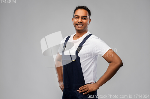 Image of happy smiling indian worker or builder